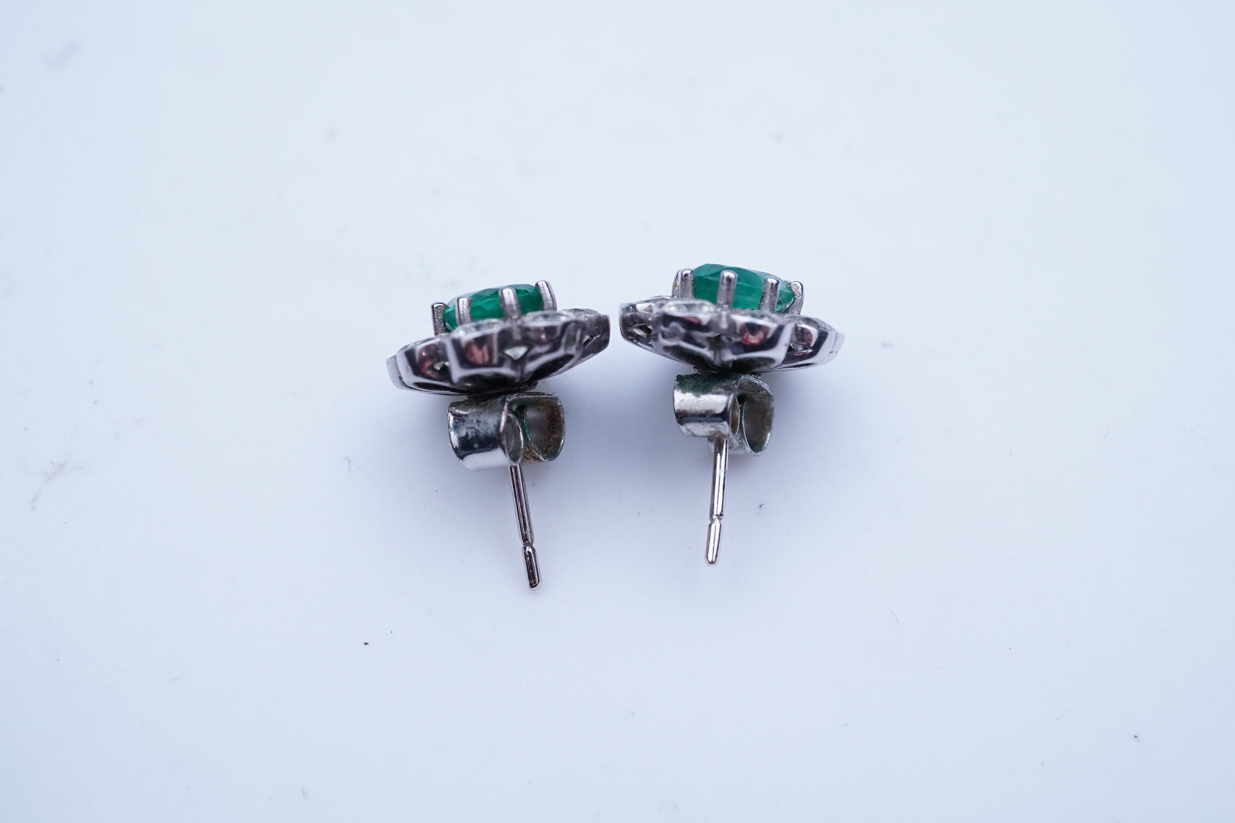 A pair of emerald and diamond earrings